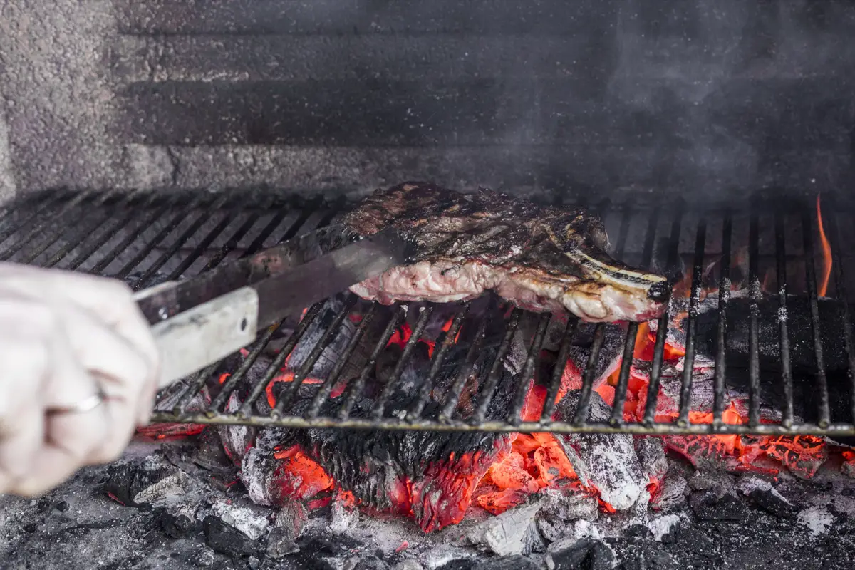 Expert butcher preparing traditional cuts